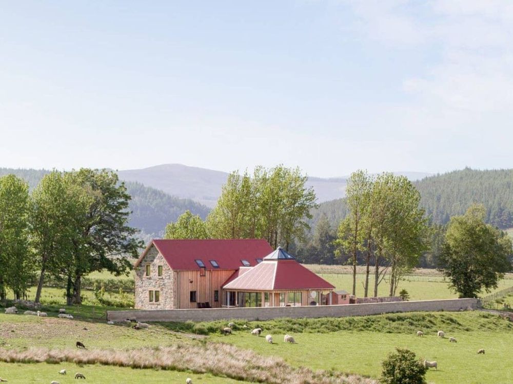Rural Holiday Let in open countryside, Cairngorm foothills in background.